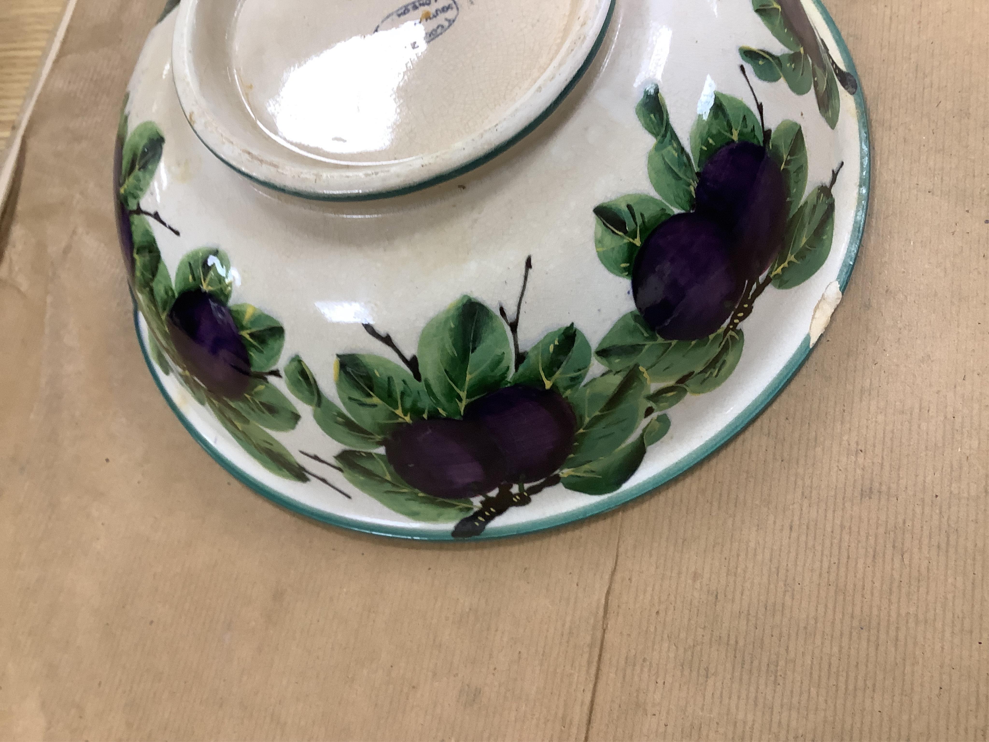 A Wemyss four-piece toilet set, a jug and basin, soap dish with liner, and bowl, damson pattern. Basin 39cm diameter., Condition - poor